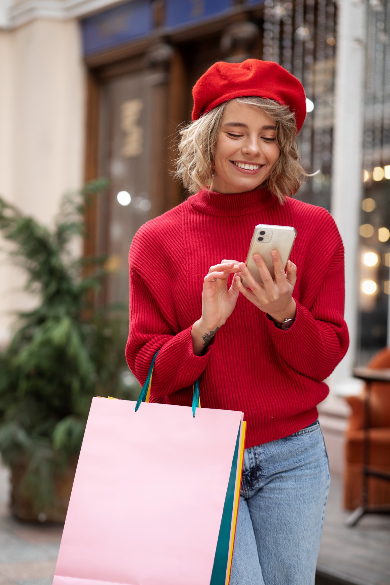 Woman smiling while shopping on her smartphone
