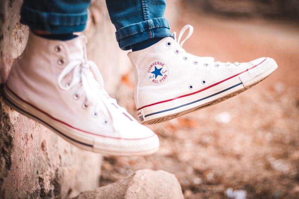 wearing white converse all star high top sneakers